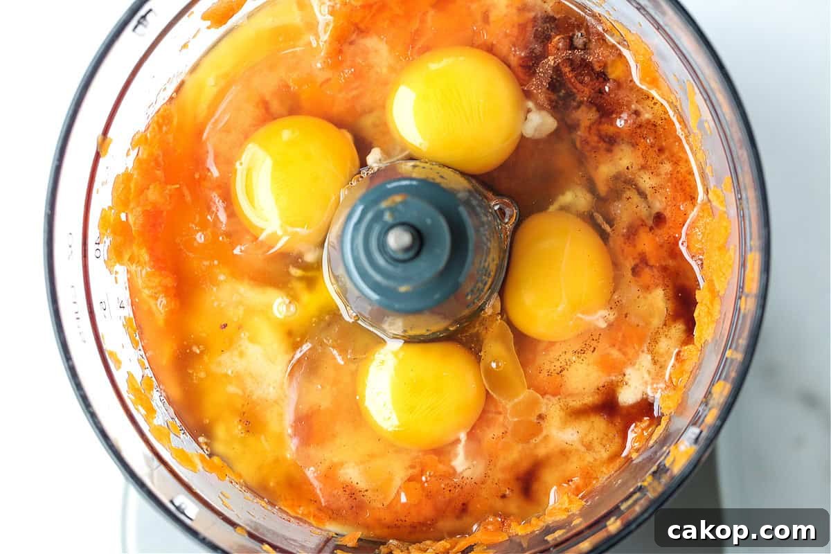 blended carrots with eggs in a food processor
