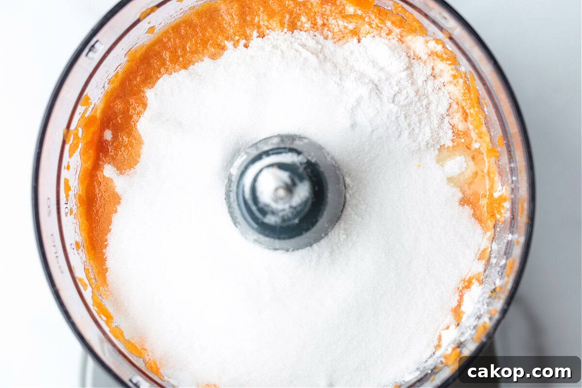 flour and sugar in a food processor with blended carrots