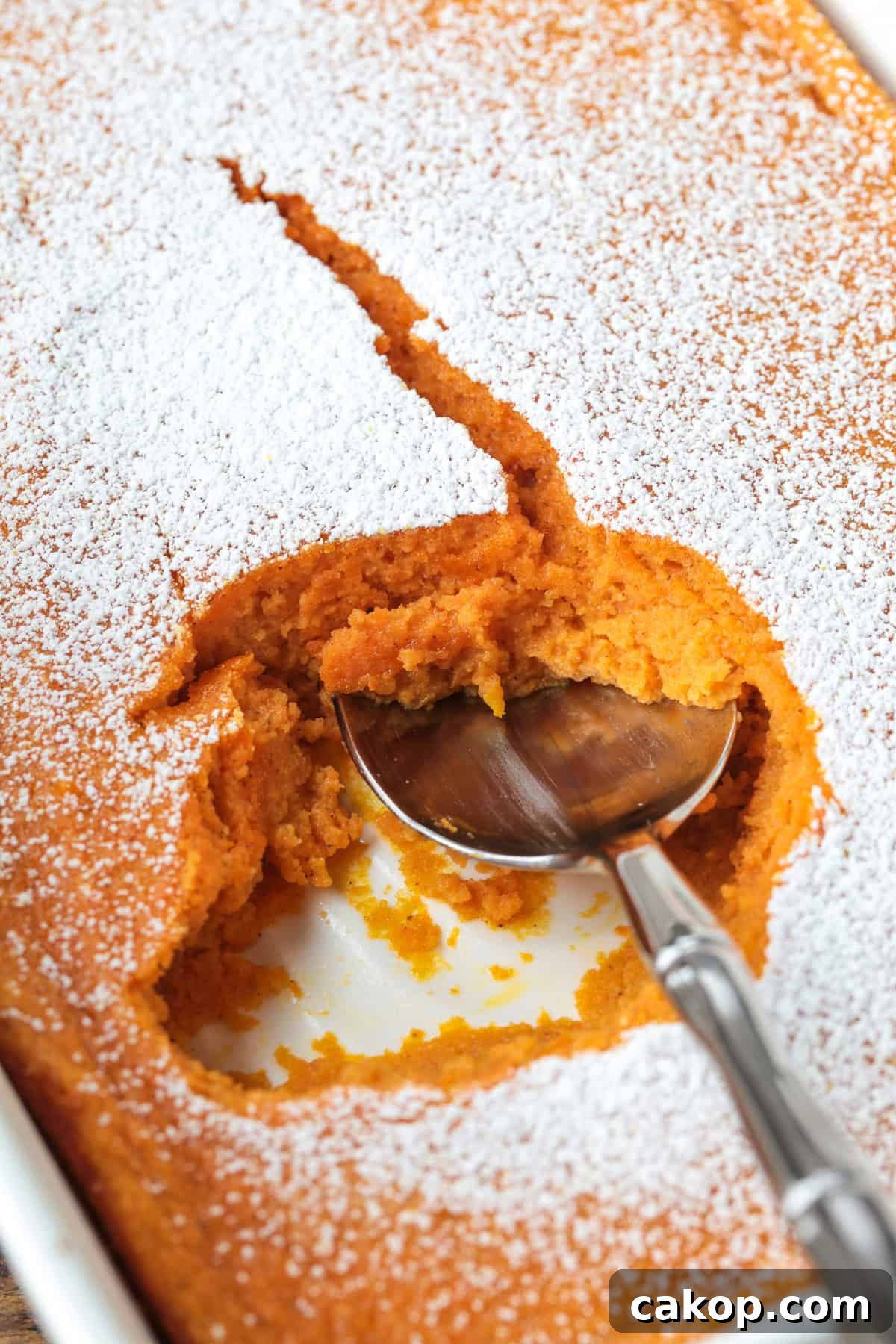 spoon scooping into carrot souffle