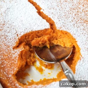 spoon scooping into carrot souffle