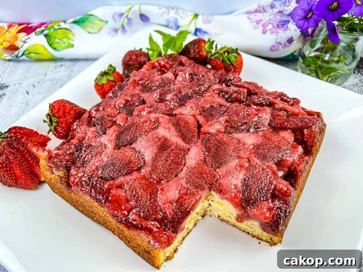 Strawberry Upside Down Cake with a slice missing.