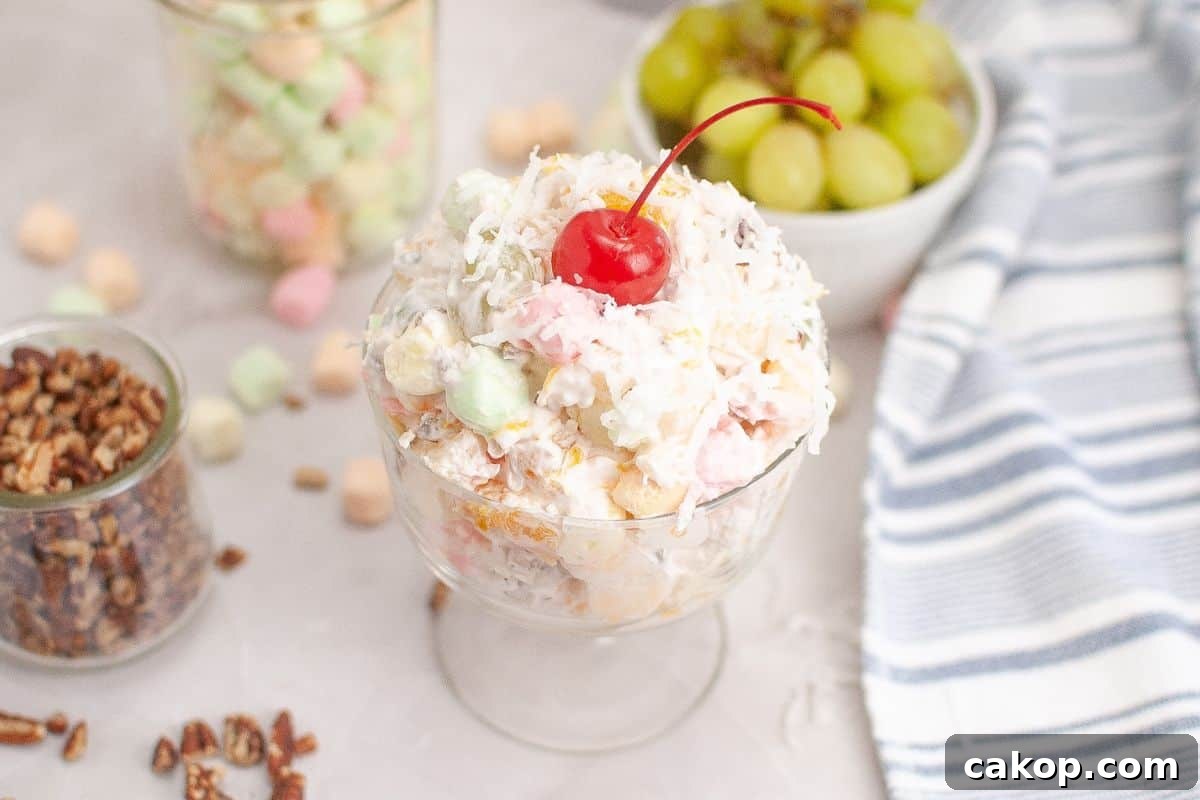 A colorful Ambrosia Salad beautifully arranged in a serving bowl.