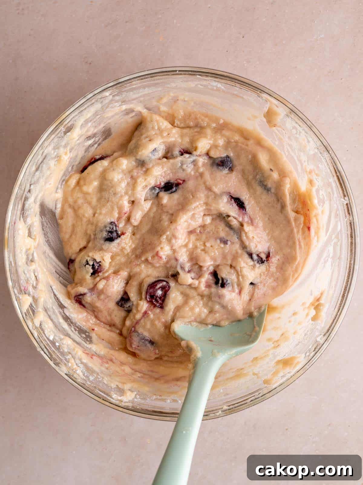 Cherry Loaf Cake Recipe: Moist Homemade Cherry Bread 6 Cherry cake batter in a bowl with a spatula.