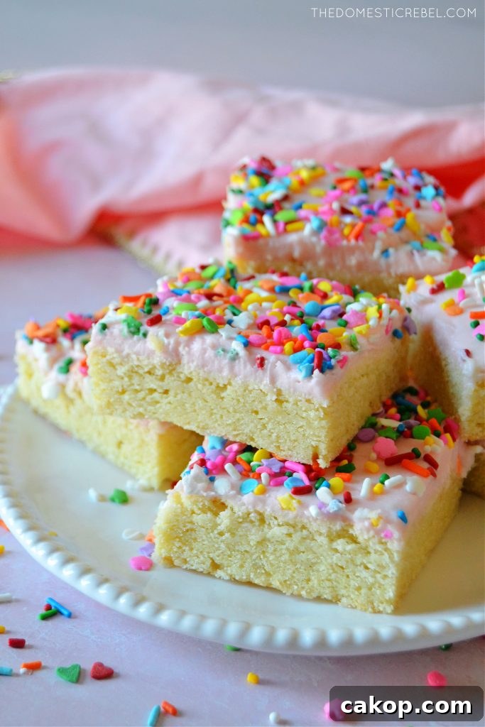 Stack of sugar cookie bars on a white plate