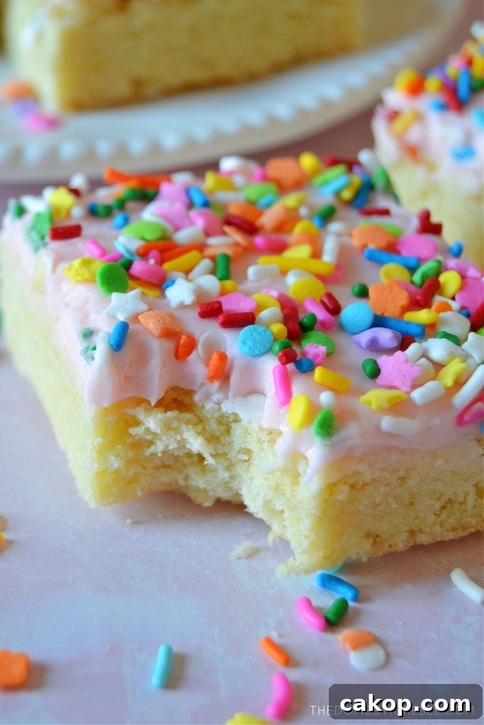Closeup of a sugar cookie bar with a bite missing