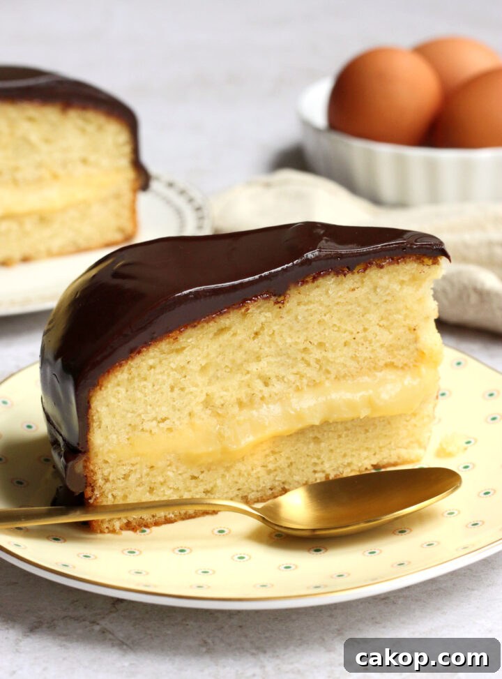 Classic Boston Cream Pie Recipe: Creamy Custard & Chocolate Glaze 2 slice of Boston cream pie on a plate