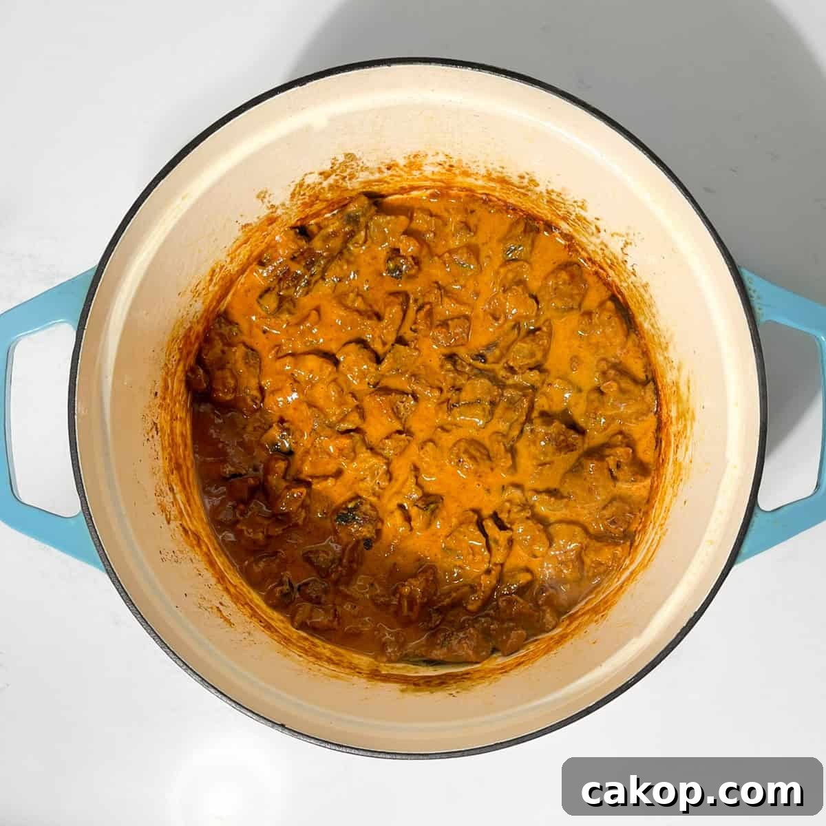 Completed beef curry with coconut milk in a large saucepan.