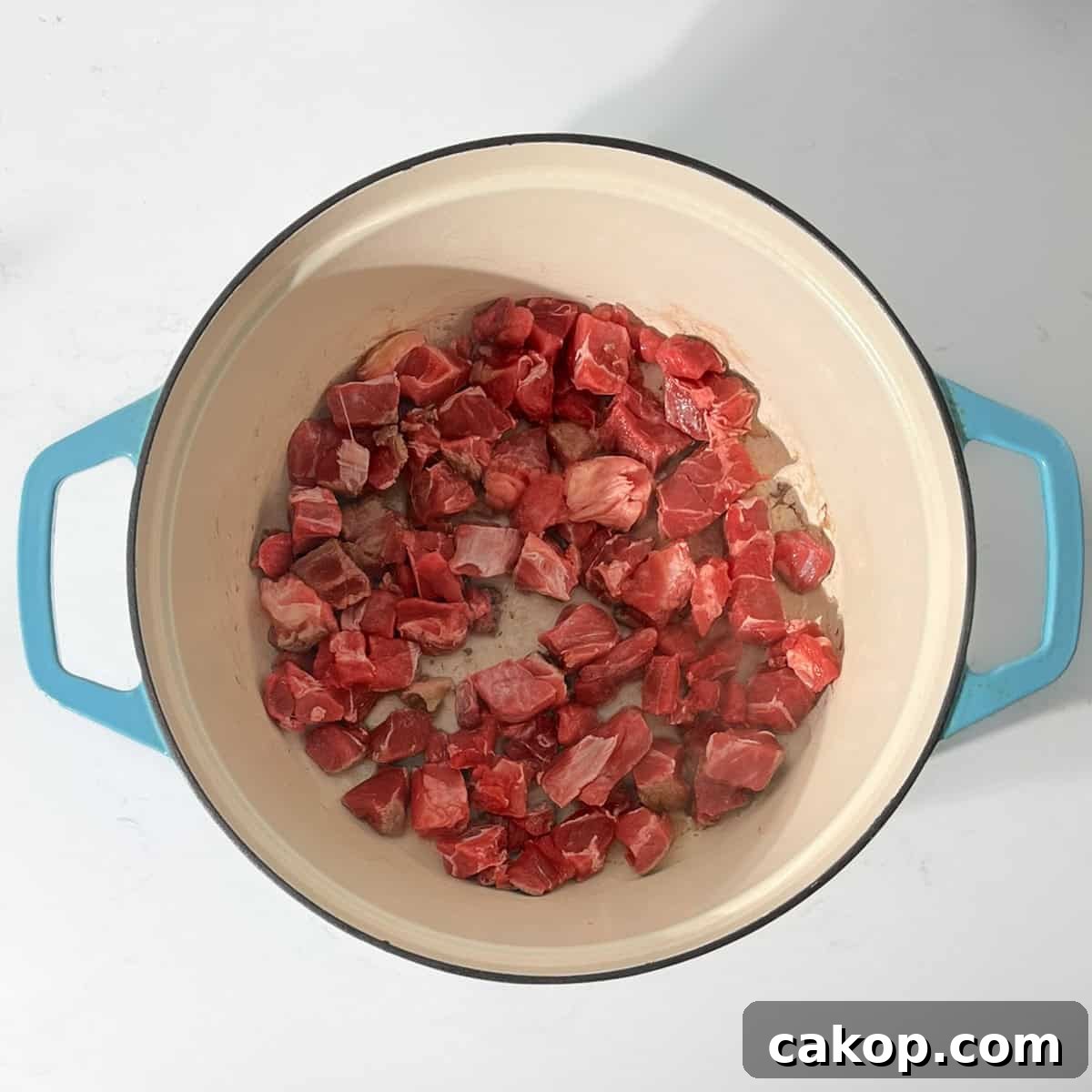 Browning the meat for the beef curry in a large saucepan.