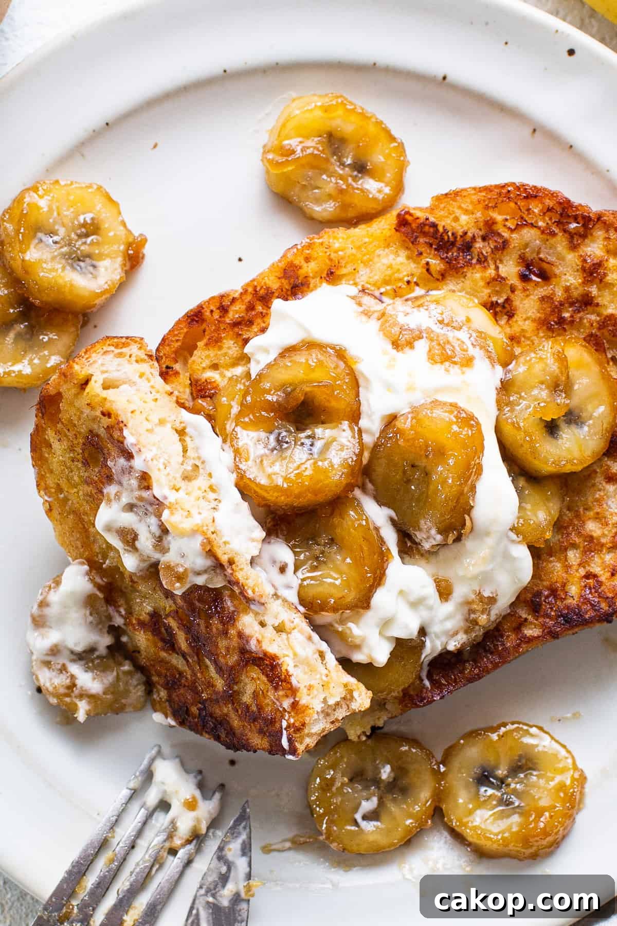 Bananas Foster French Toast Recipe for Brunch or Dessert 6 French toast with bananas and whipped cream.