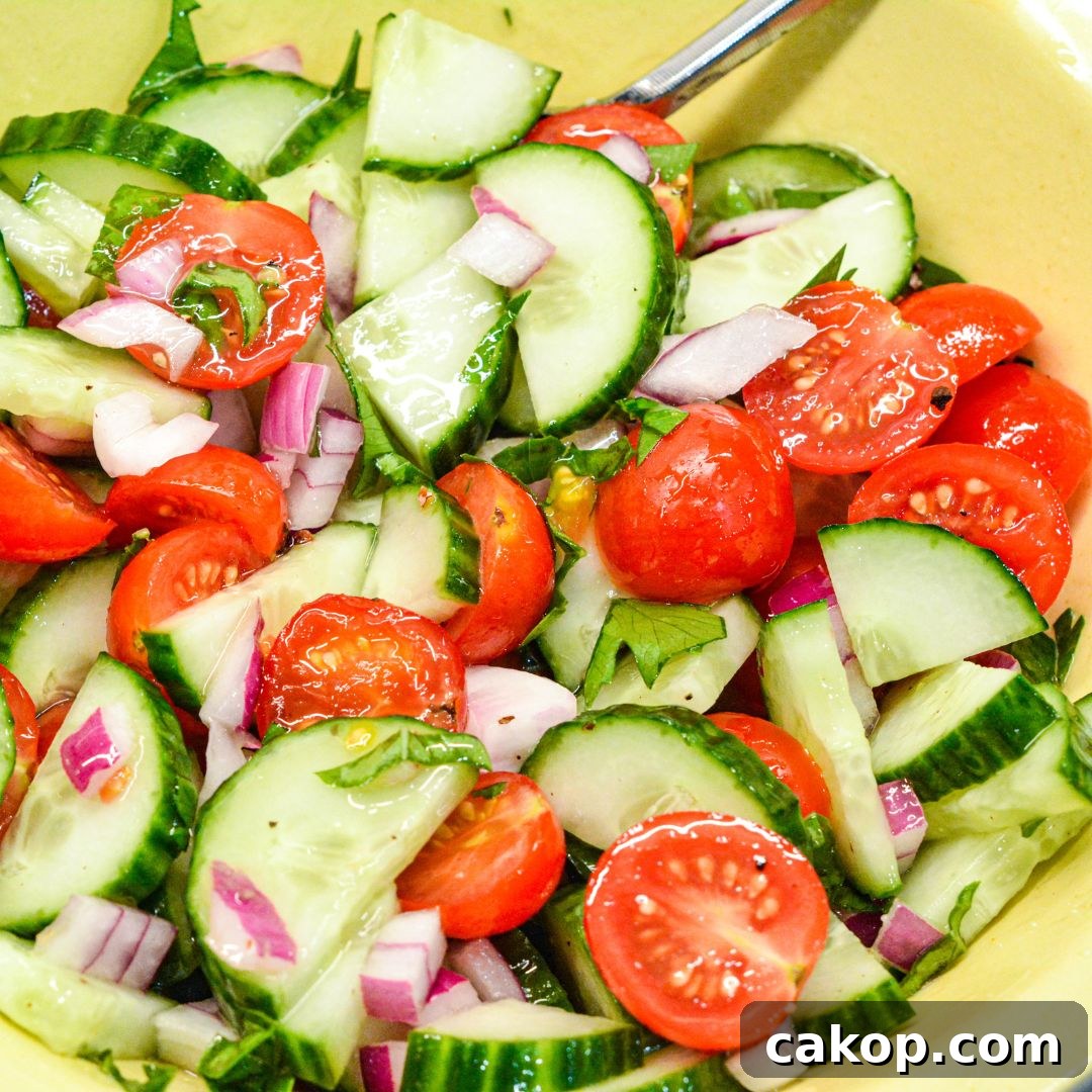 Cucumber and tomato salad with homemade dressing.