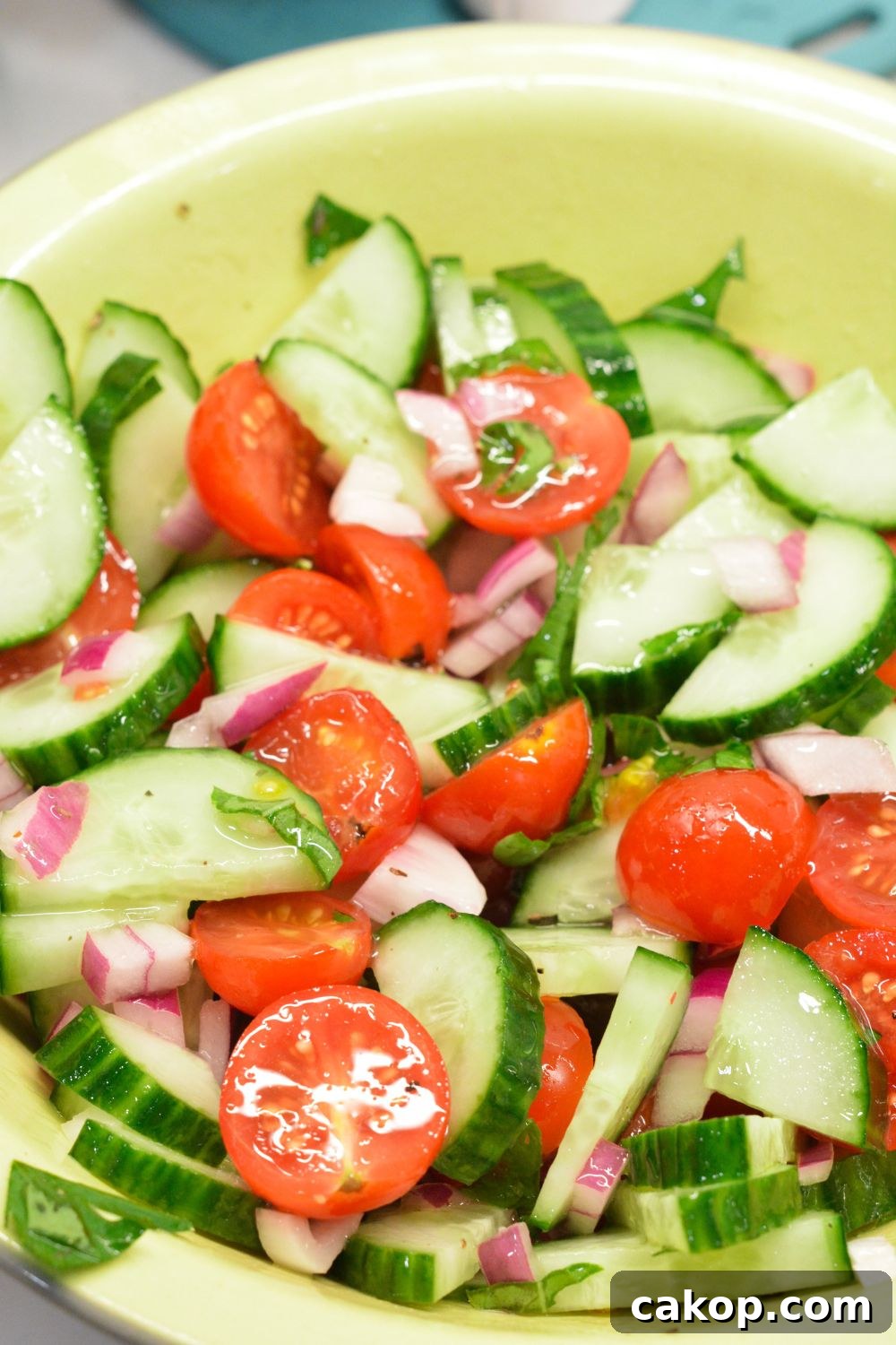 Cucumber and tomato salad is the perfect summer salad with homemade dressing that can be a high protein cucumber, tomato, and onion salad with cottage cheese.