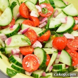 Cucumber and tomato salad is the perfect summer salad with homemade dressing that can be a high protein cucumber, tomato, and onion salad with cottage cheese.