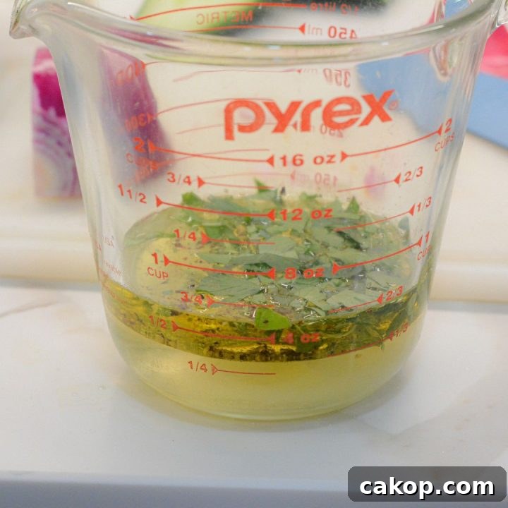 Mix vinegar, olive oil, sugar, salt, pepper and herbs to make the dressing.