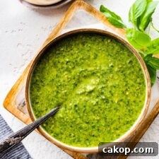 Spoon in a bowl of pesto Genovese.