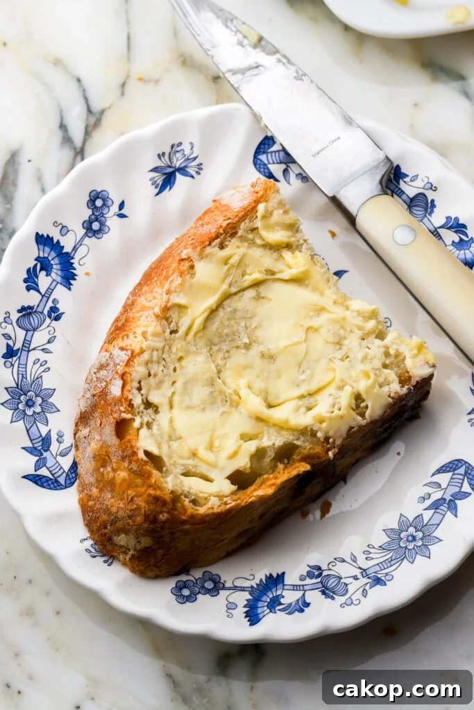 Slice of Italian bread on a plate with butter