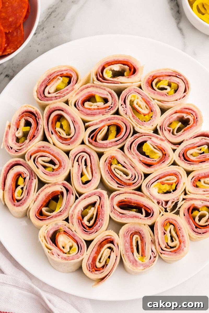 sliced Italian Pinwheels on a white plate.
