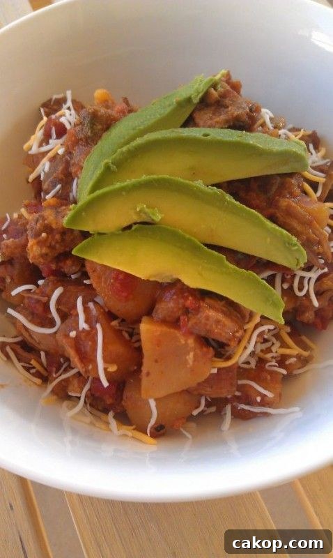 Pork Tinga with Potatoes, Avocado and Cheese