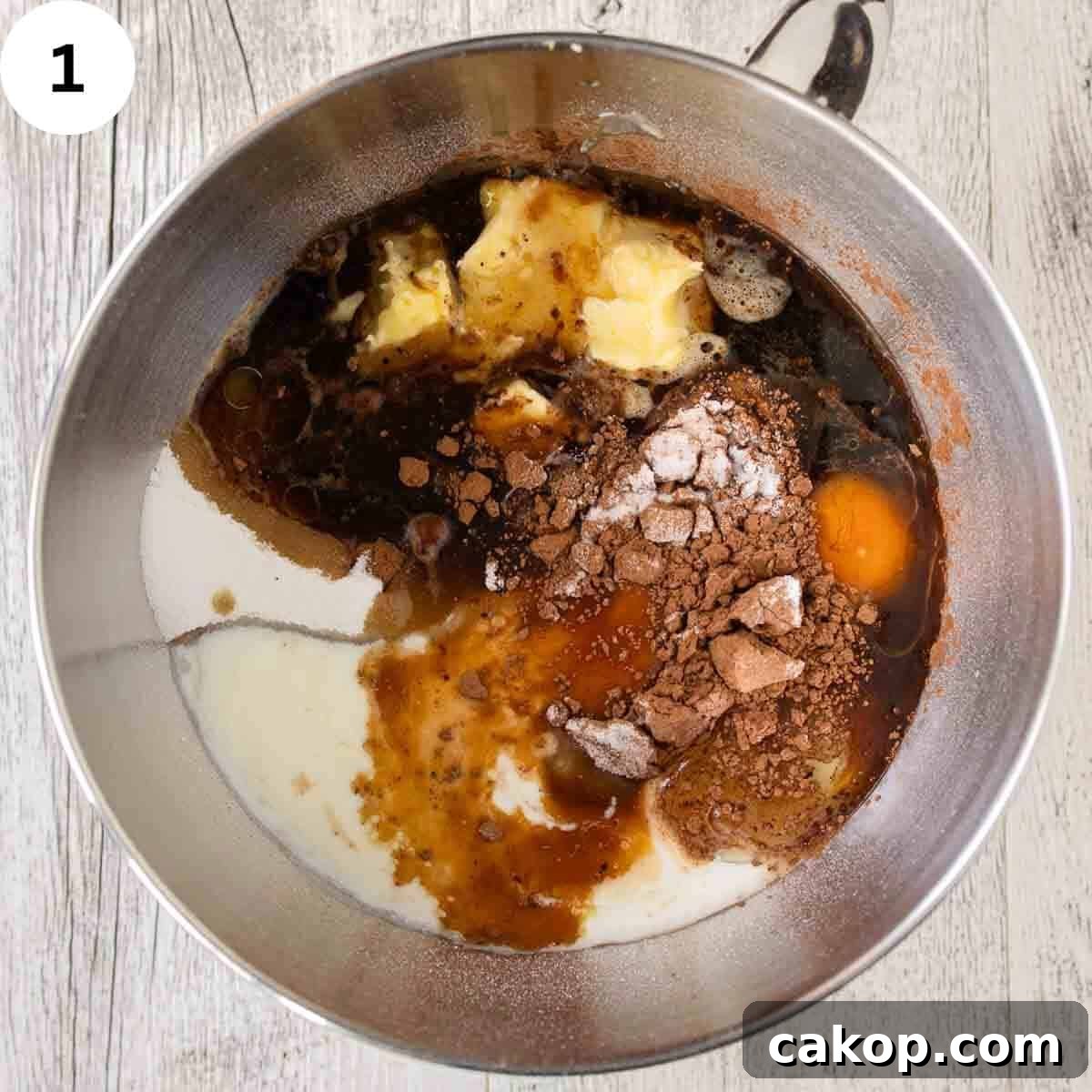 Decadent Chocolate Peanut Butter Cake Recipe 4 Ingredients for cake batter in a stainless bowl.