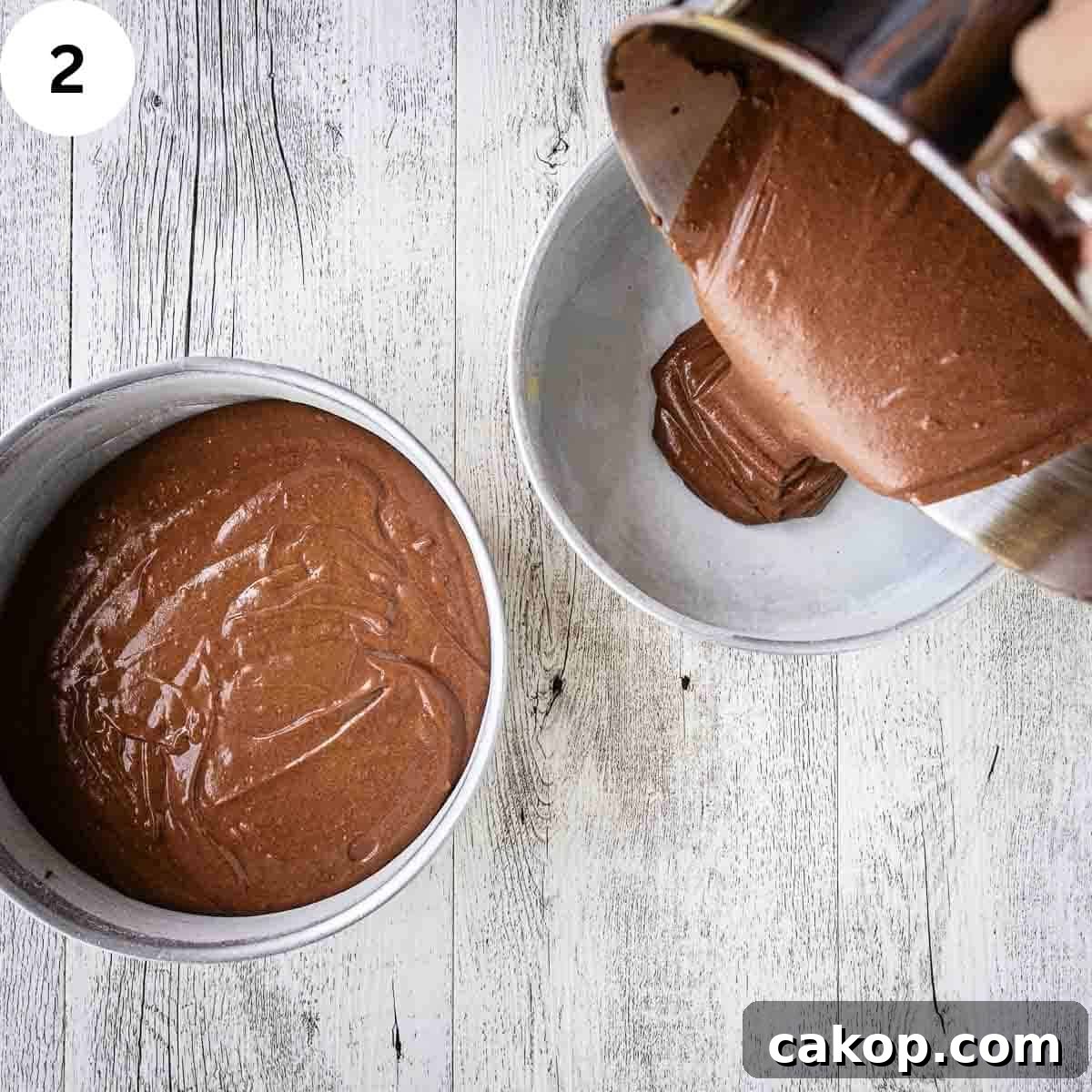 Decadent Chocolate Peanut Butter Cake Recipe 5 Chocolate cake batter being poured into round cake pans.