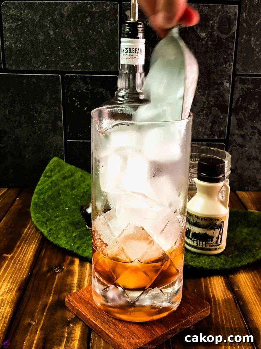 Add cubed ice to your stirring glass.