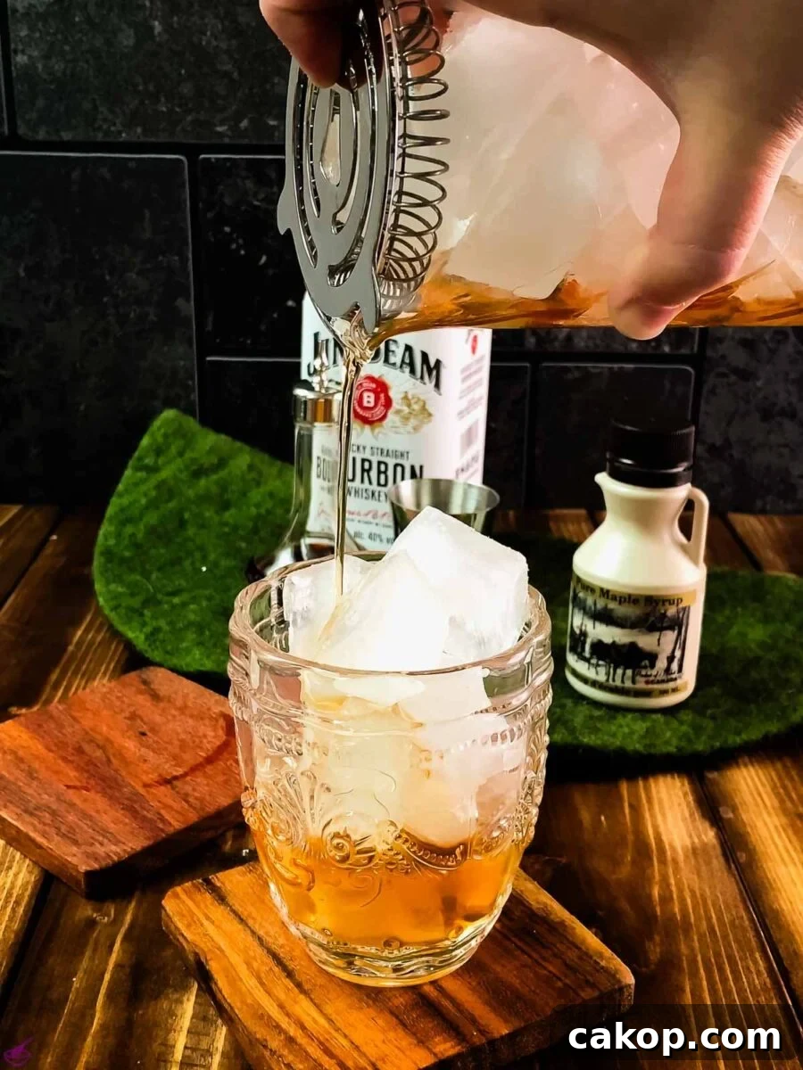 Pour your maple old fashioned into a rocks glass filled with cubed ice.