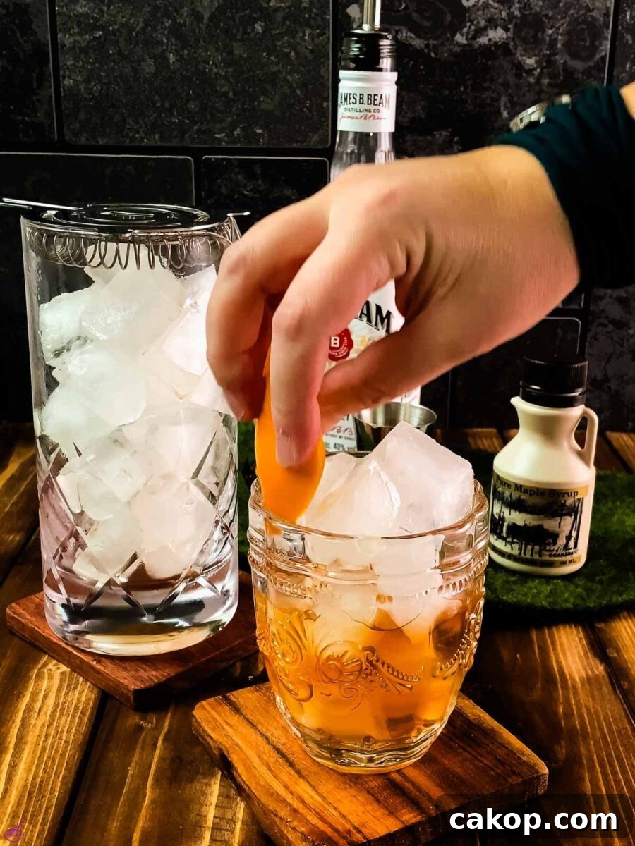 Garnish your maple old fashioned with an orange zest.