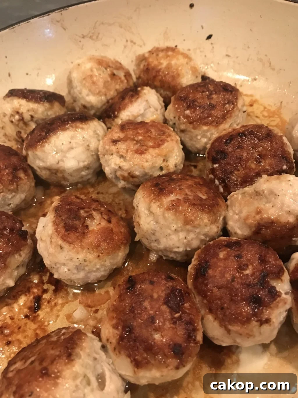One-Pan Italian Meatball Skillet with Tomato Sauce and Pasta 6 A close up of browned meatballs