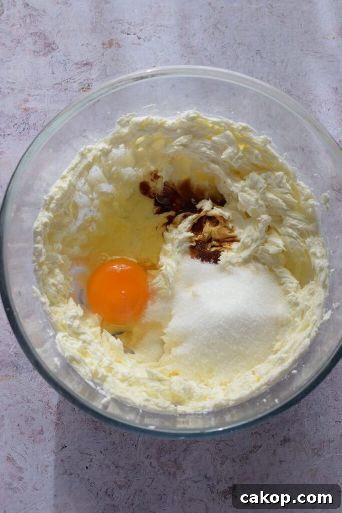 Cheesecake ingredients in a glass bowl.