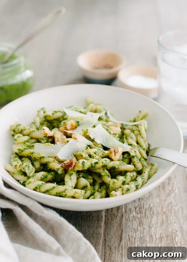 Swiss Chard and Walnut Pesto Pasta Recipe for Flavorful Weeknights 2 A white bowl filled with Swiss Chard Walnut Pesto Pasta.