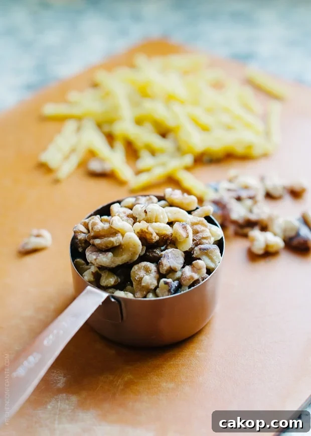 Swiss Chard and Walnut Pesto Pasta Recipe for Flavorful Weeknights 4 Walnuts in a metal measuring cup.
