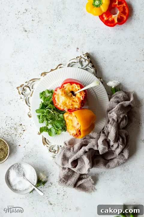 Stuffed peppers on a plate over an embossed board