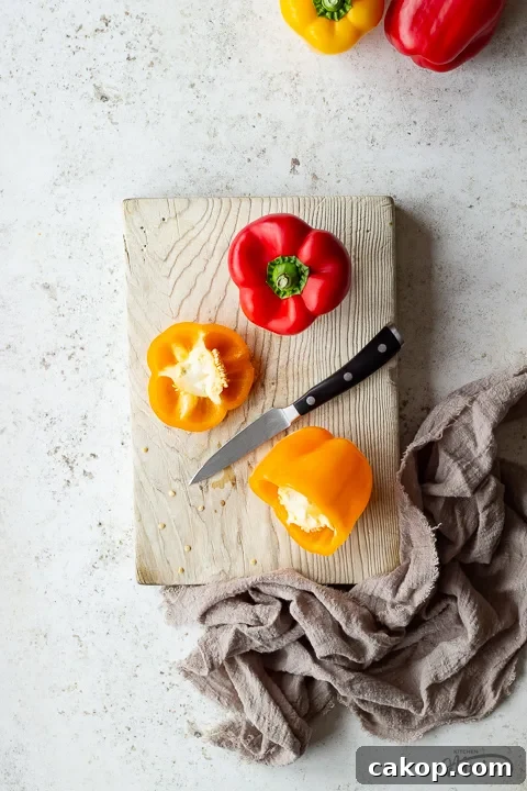 Bell peppers being chopped on a board