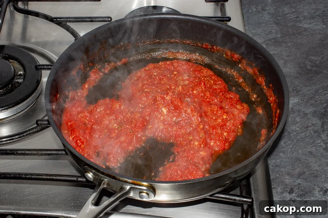 Thickened and reduced tomato sauce in a pan