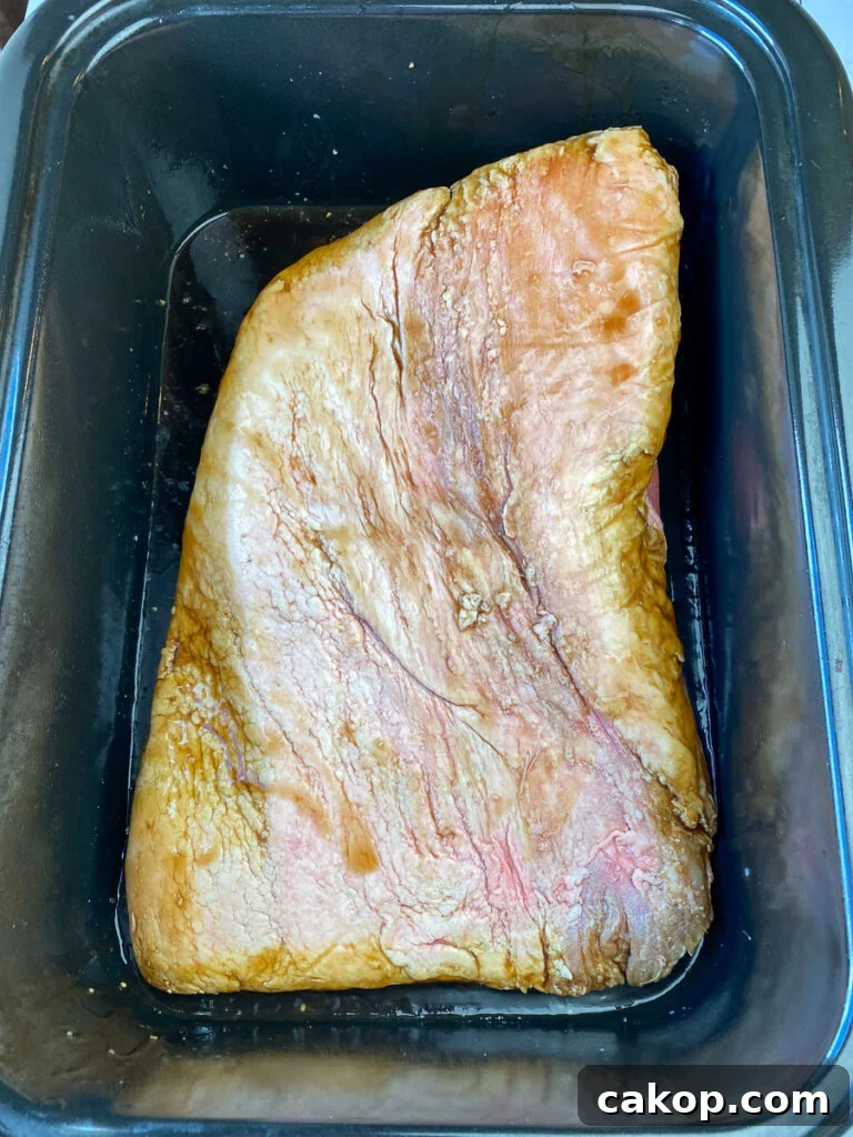 Brisket marinating for 48 hours in a roaster pan