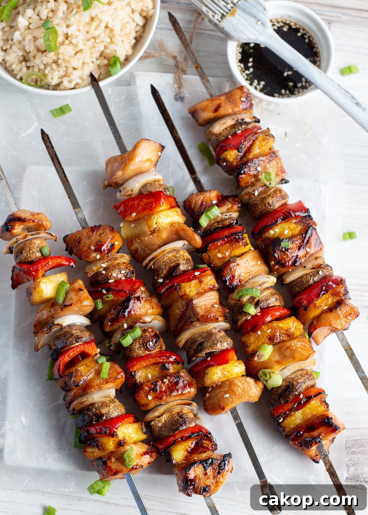 Grilled Teriyaki Chicken and Pineapple Kabobs Recipe 9 Picture of cooked skewers with chicken, pineapple, mushrooms, onion and peppers.
