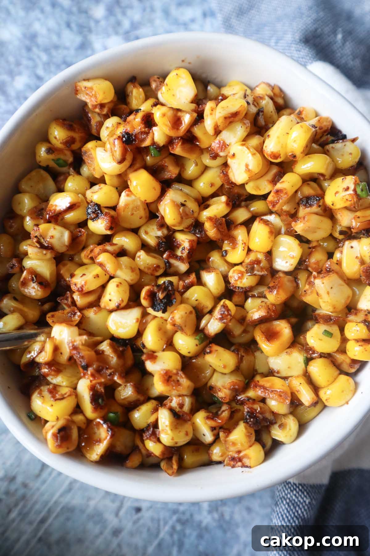 white bowl with blackened corn 
