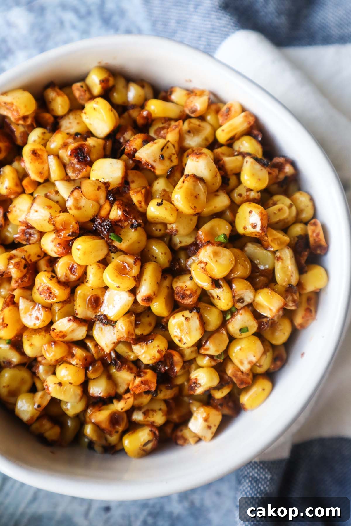 white bowl with blackened corn 