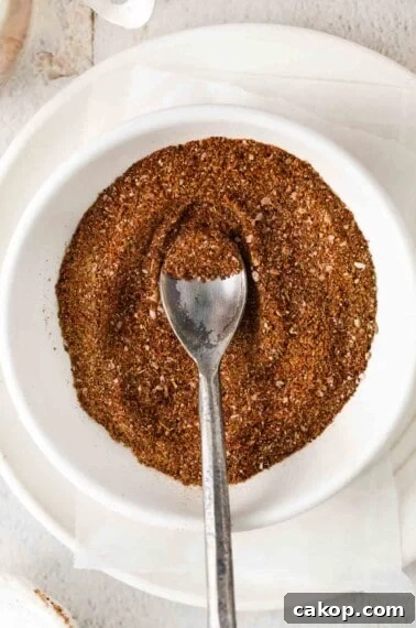 Taco seasoning in a bowl with a spoon