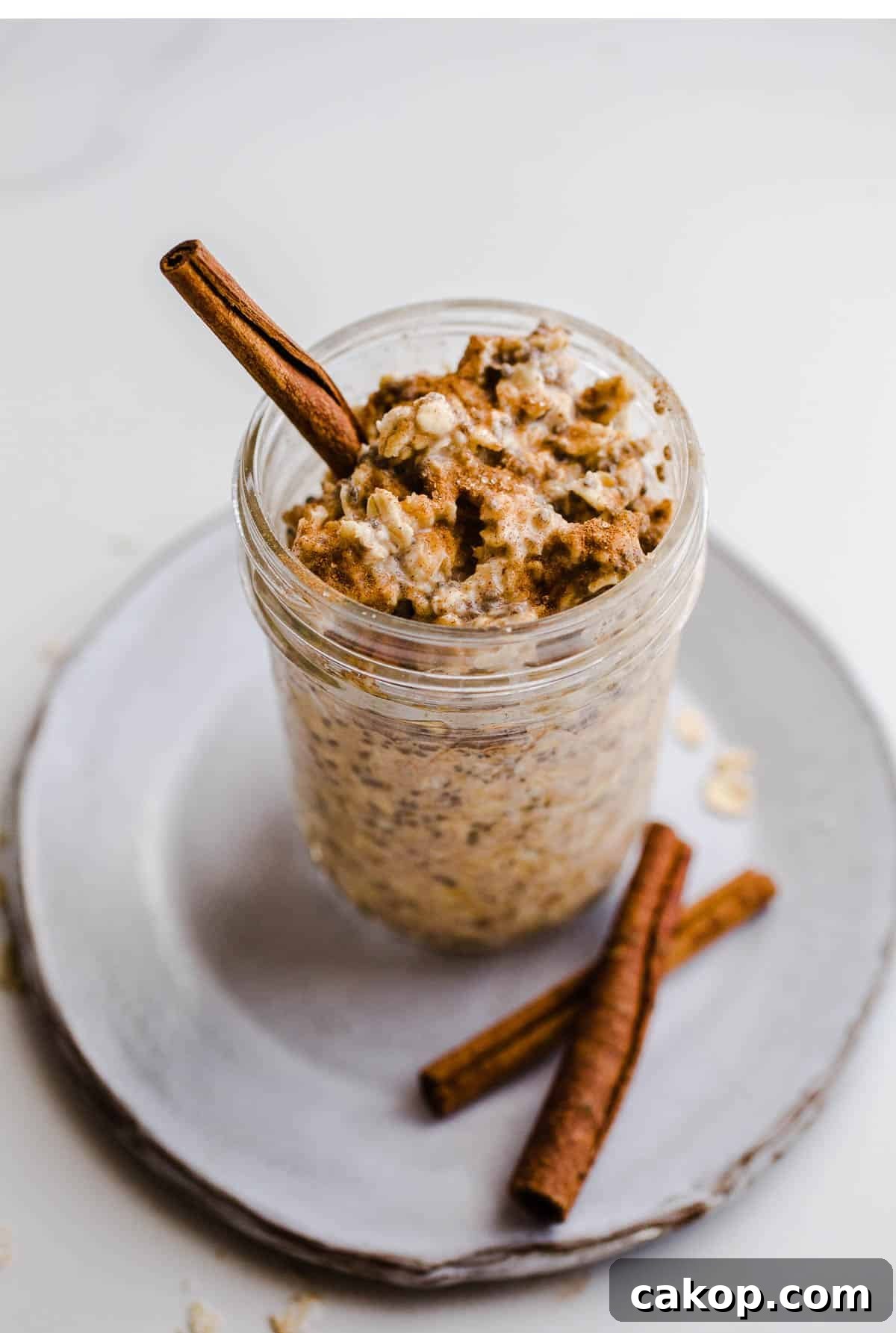 Oats and cinnamon stick in a jar. 