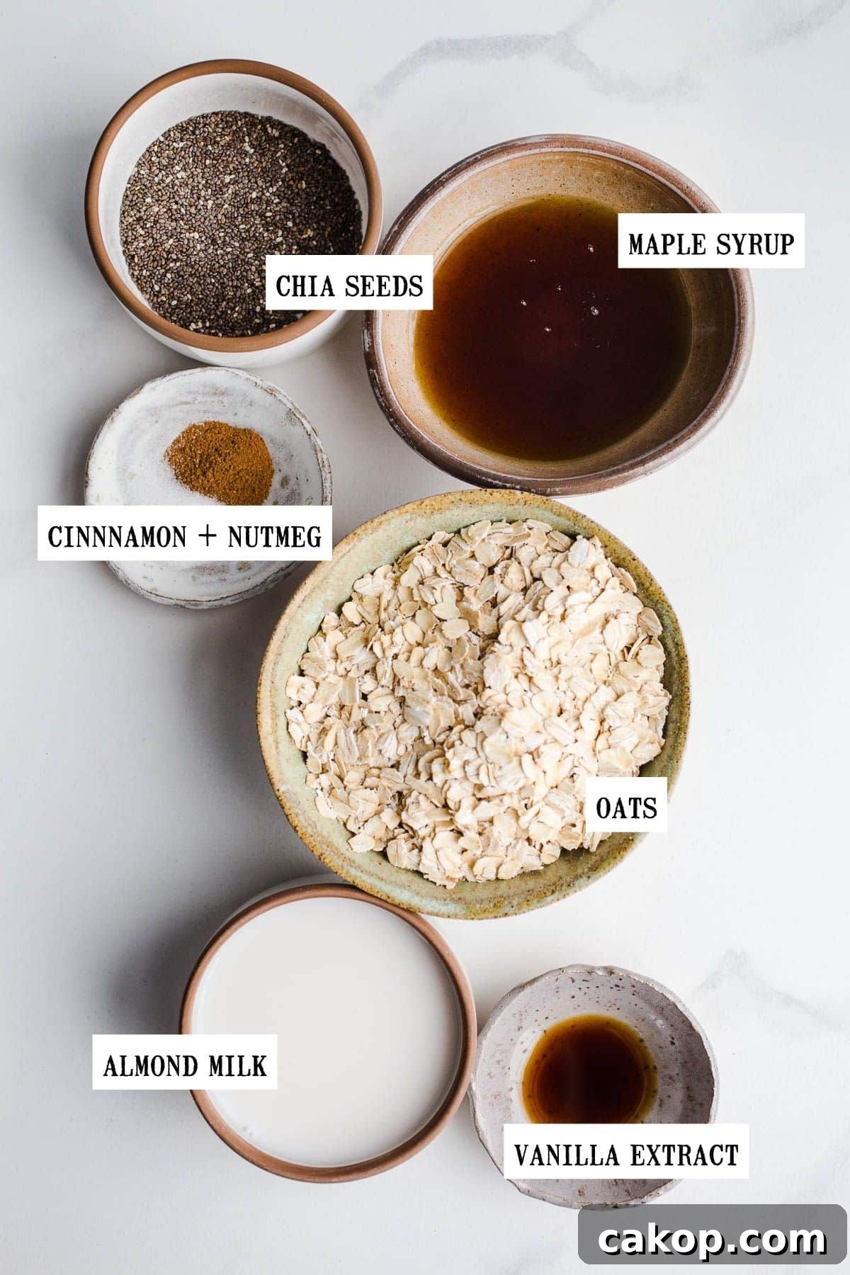 Ingredients for overnight oats in small bowls. 