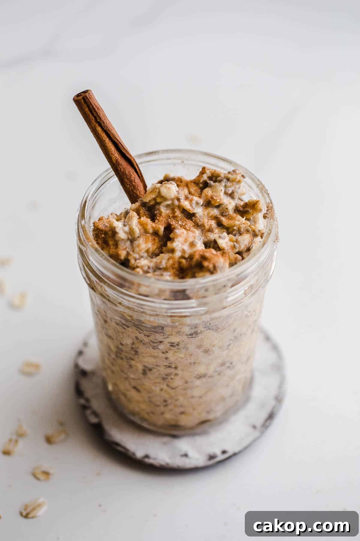 A mason jar filled with creamy oats. 