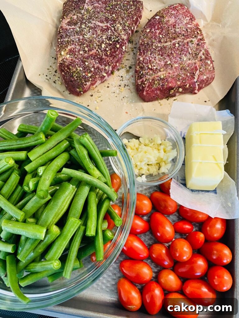 Blackstone Ribeye with Sautéed Garlic Green Beans 3 prepped ingredients on a tray