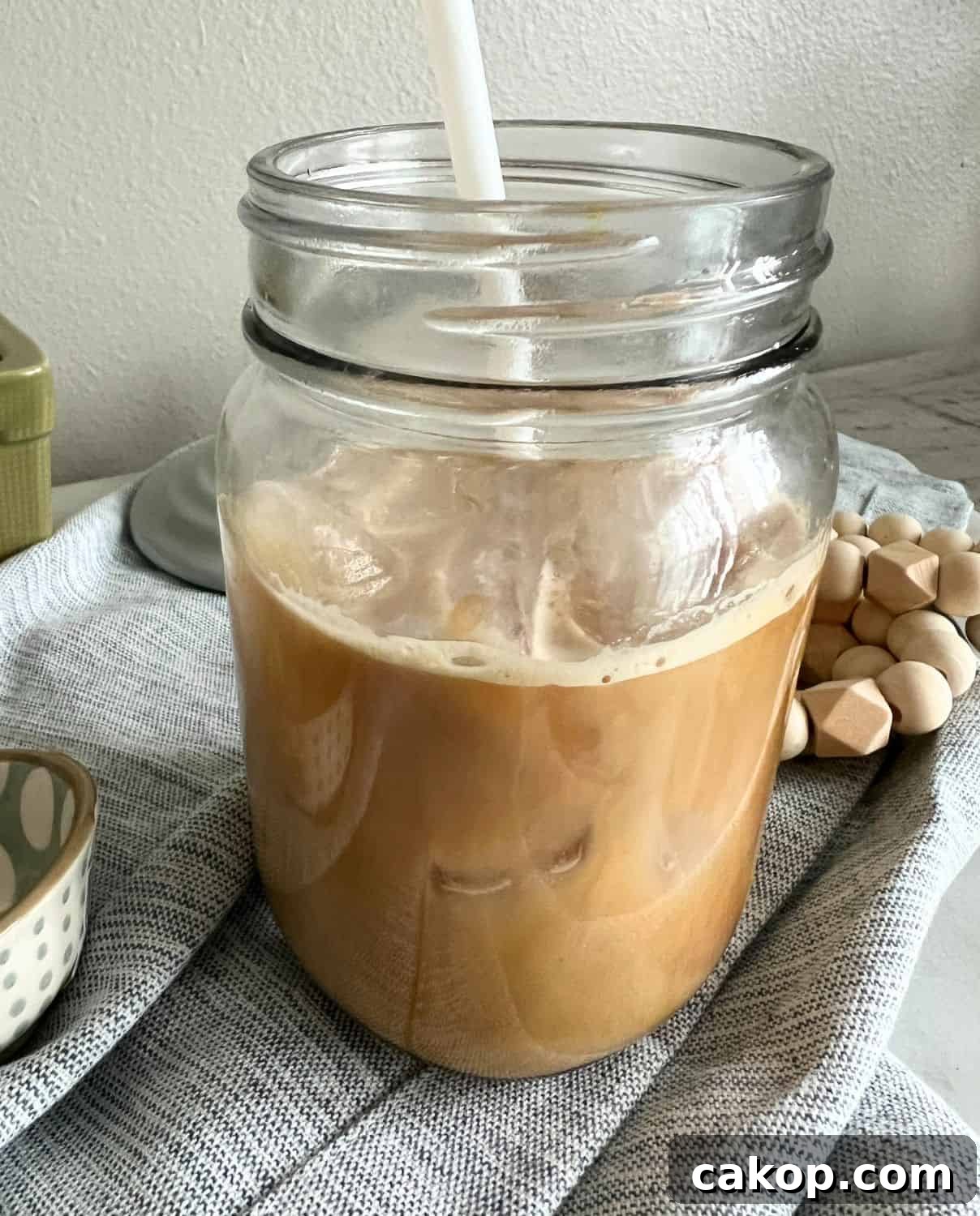 Sugar Cookie Latte with Sugar Cookie Syrup in a glass jar. 