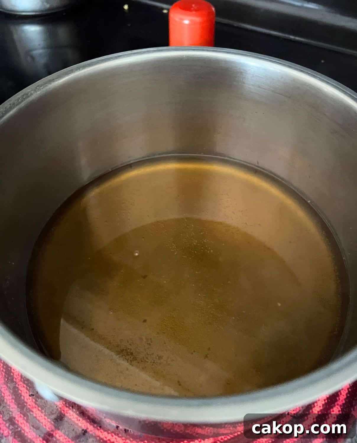 Sugars and water combined in a pan. 