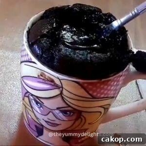2-Minute Microwave Chocolate Mug Cake Recipe 9 close-up of molten lava in chocolate mug cake.