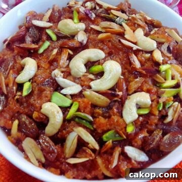 gajar halwa made in pressure cooker served in a glass jar.