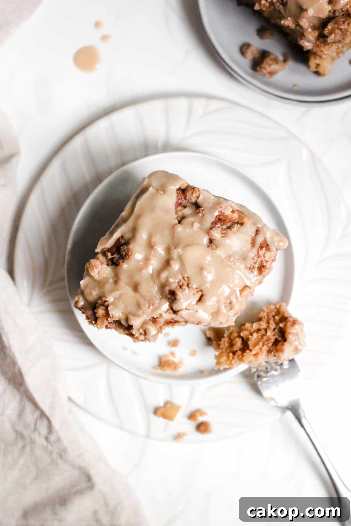 Maple Glazed Apple Coffee Cake Slice of Healthier Breakfast Apple Cake with Crumble Topping and Maple Glaze