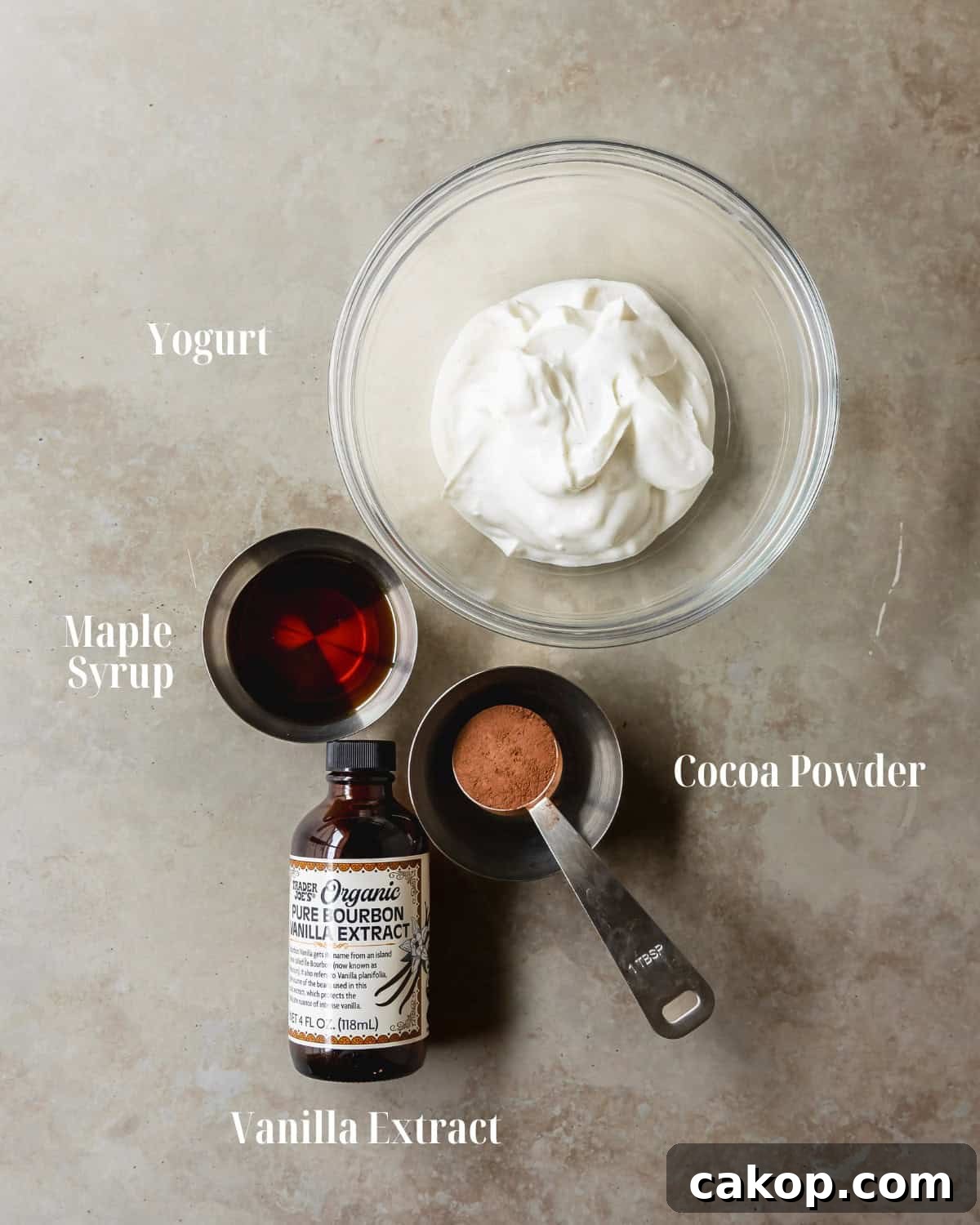Yogurt Layer: Gather yogurt, maple syrup, vanilla and cocoa powder for dusting.