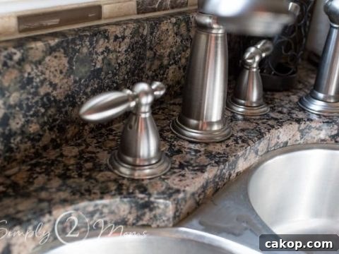 kitchen sink faucet after removing hard water stains on granite