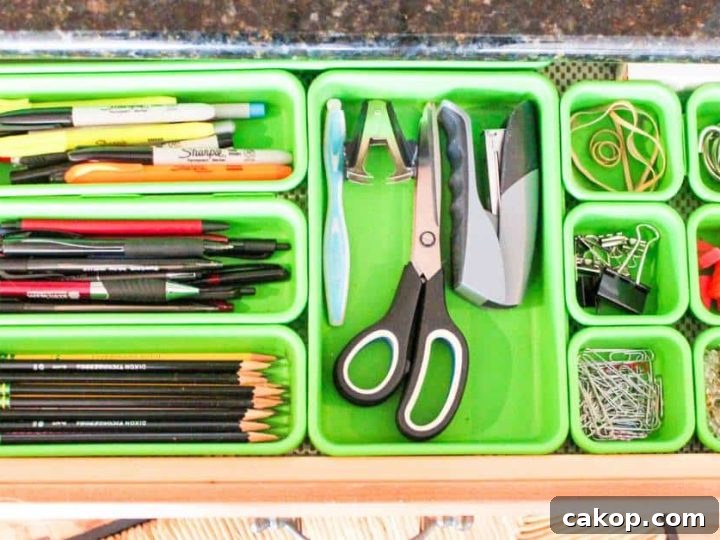 inside view of organized family kitchen desk drawer